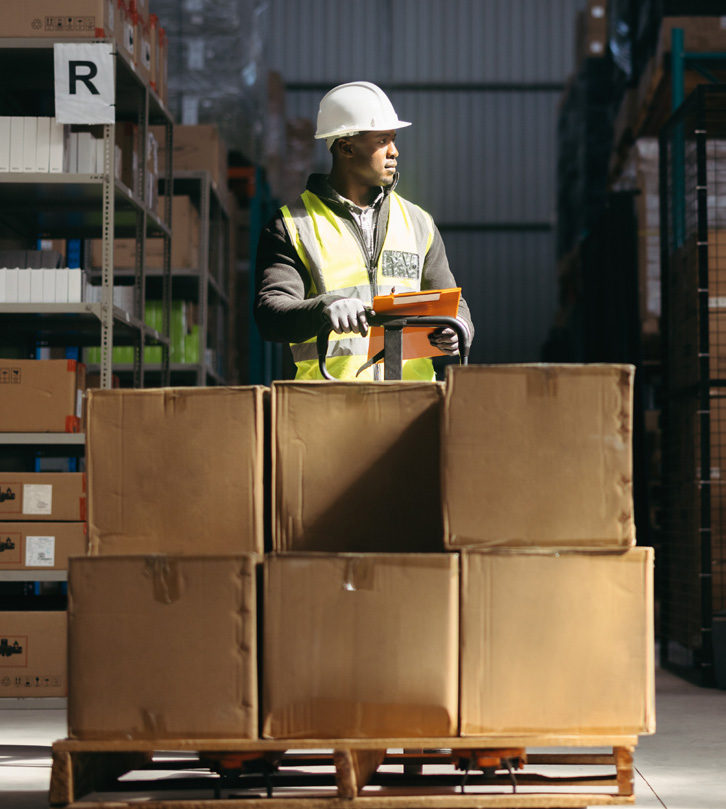 Warehouse worker operating a forklift